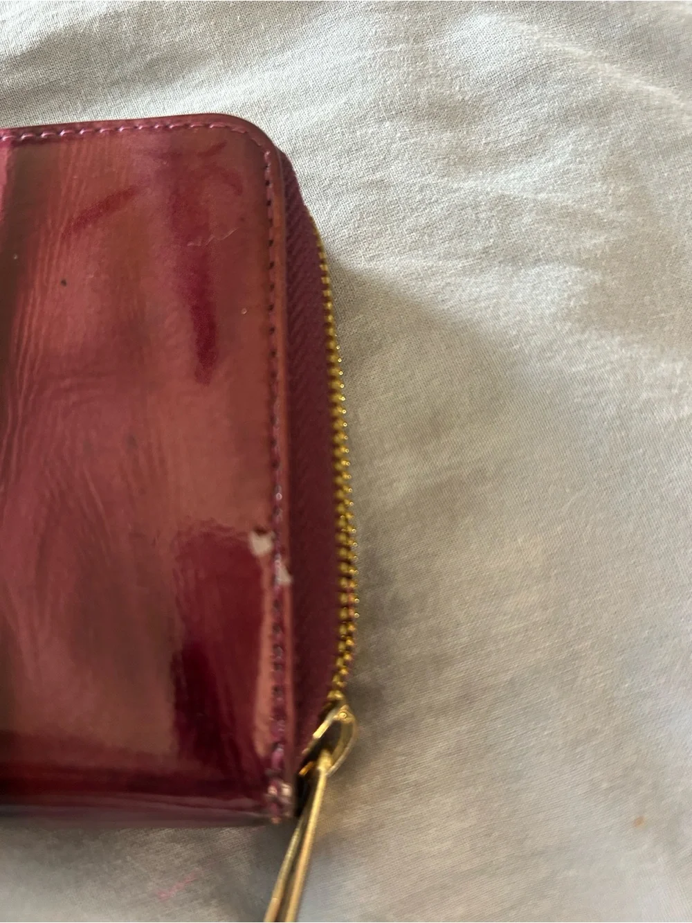 Hard to find patterned Patent Purple Wristlet Wallet with Gold Tone Hardware.